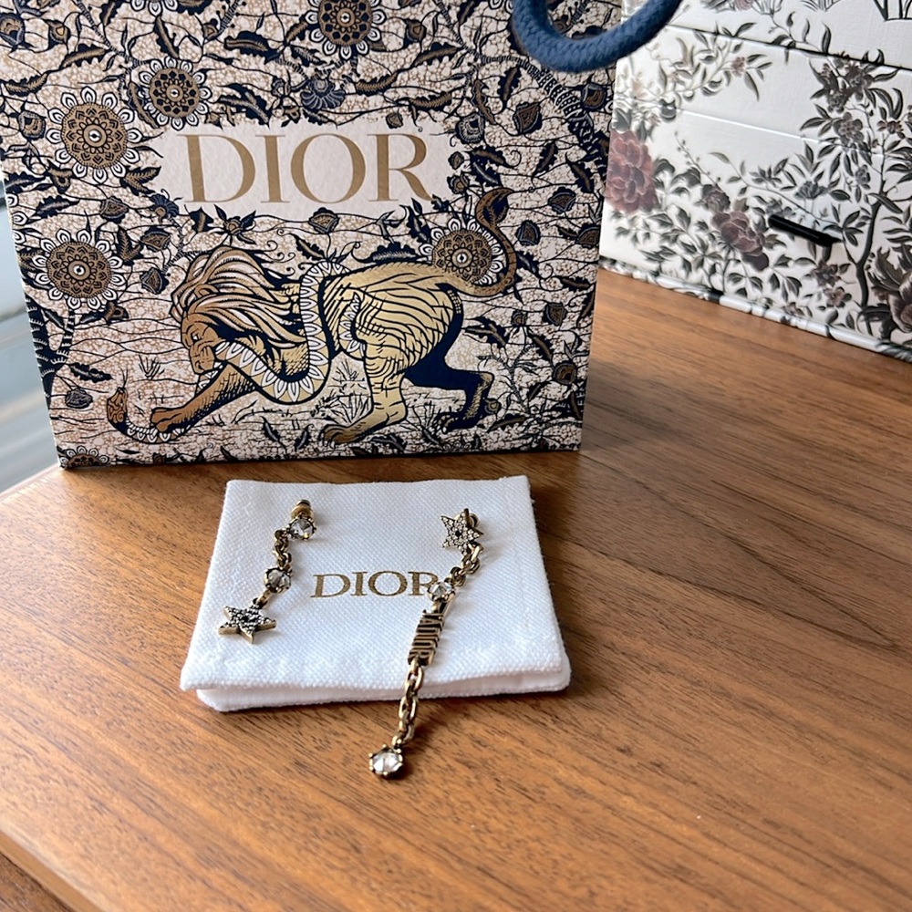Dior earrings uneven design, can be worn single or a pair.